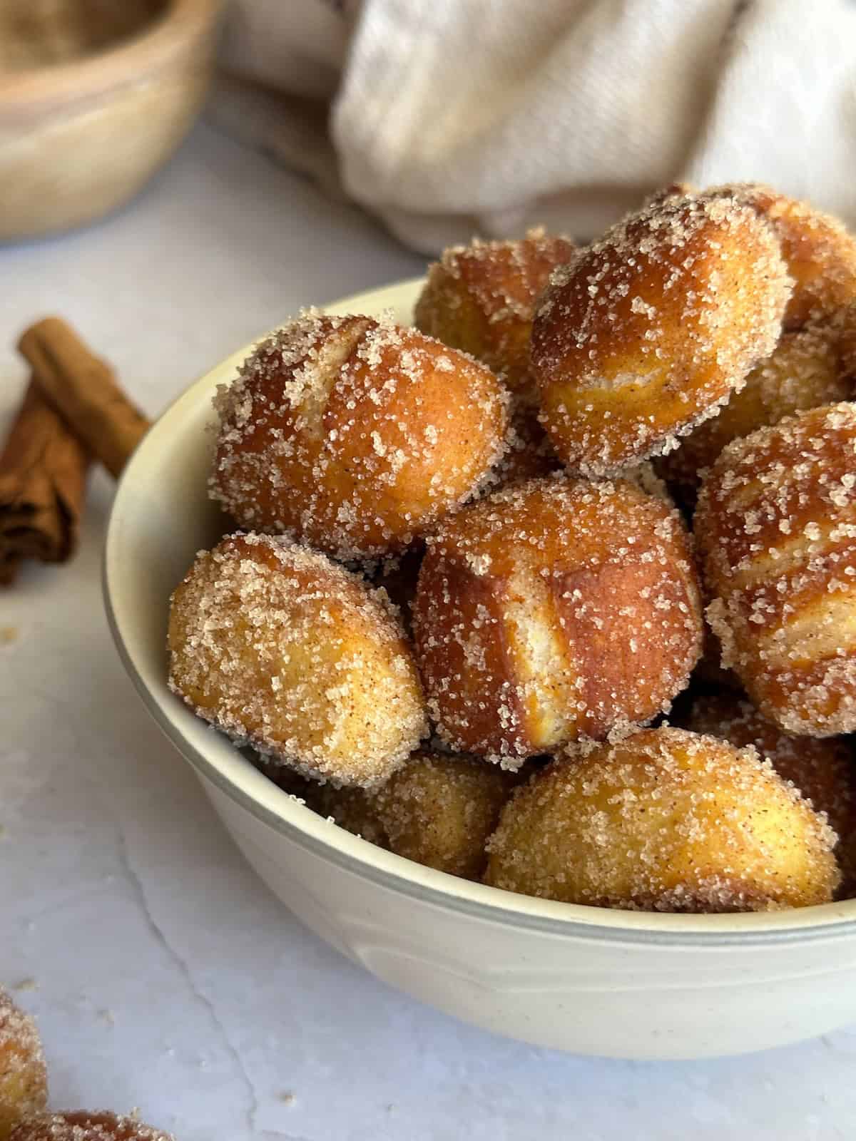 cinnamon sugar sourdough pretzel bites in bowl.
