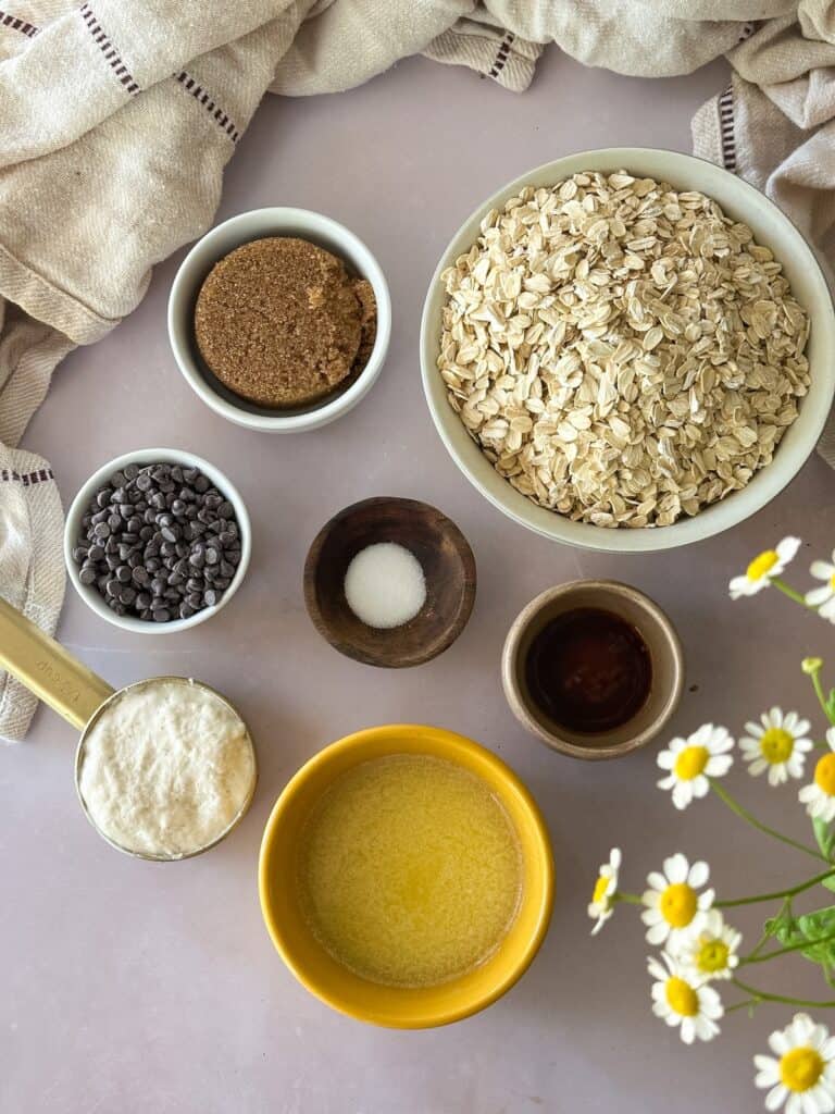 sourdough granola bar ingredients in individual bowls.