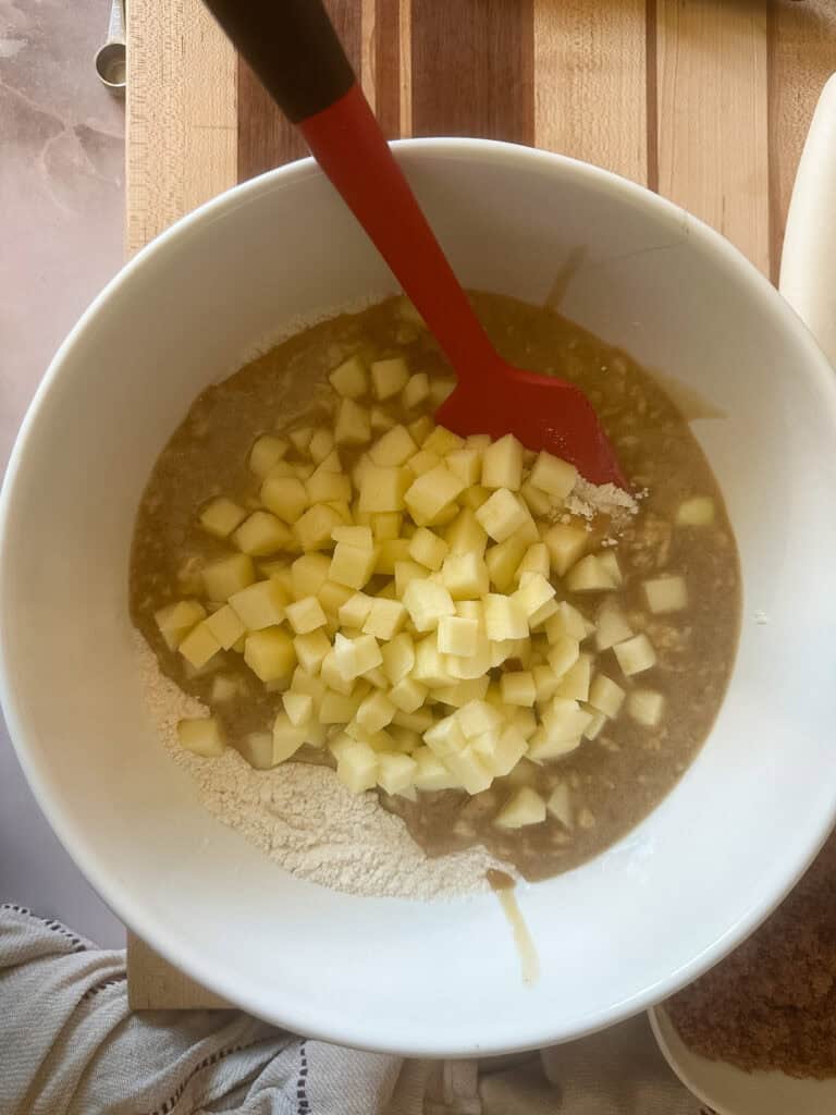 sourdough discard apple bread batter about to be stirred together.